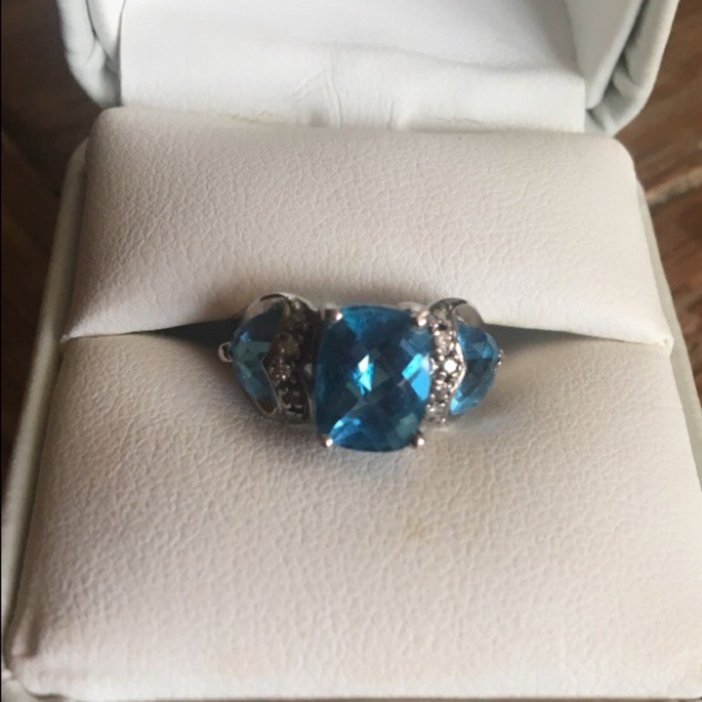 Blue topaz/diamond ring